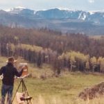 Photo of Lorenzo Chavez painting in the Big Horn Mt of Wyoming
