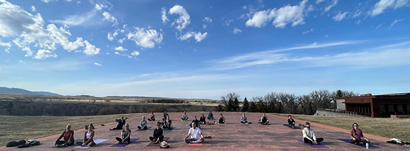 Image of people doing yoga outside
